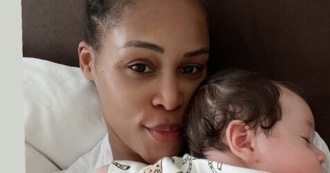 As she holds her son, Eve says she's "never been this happy"